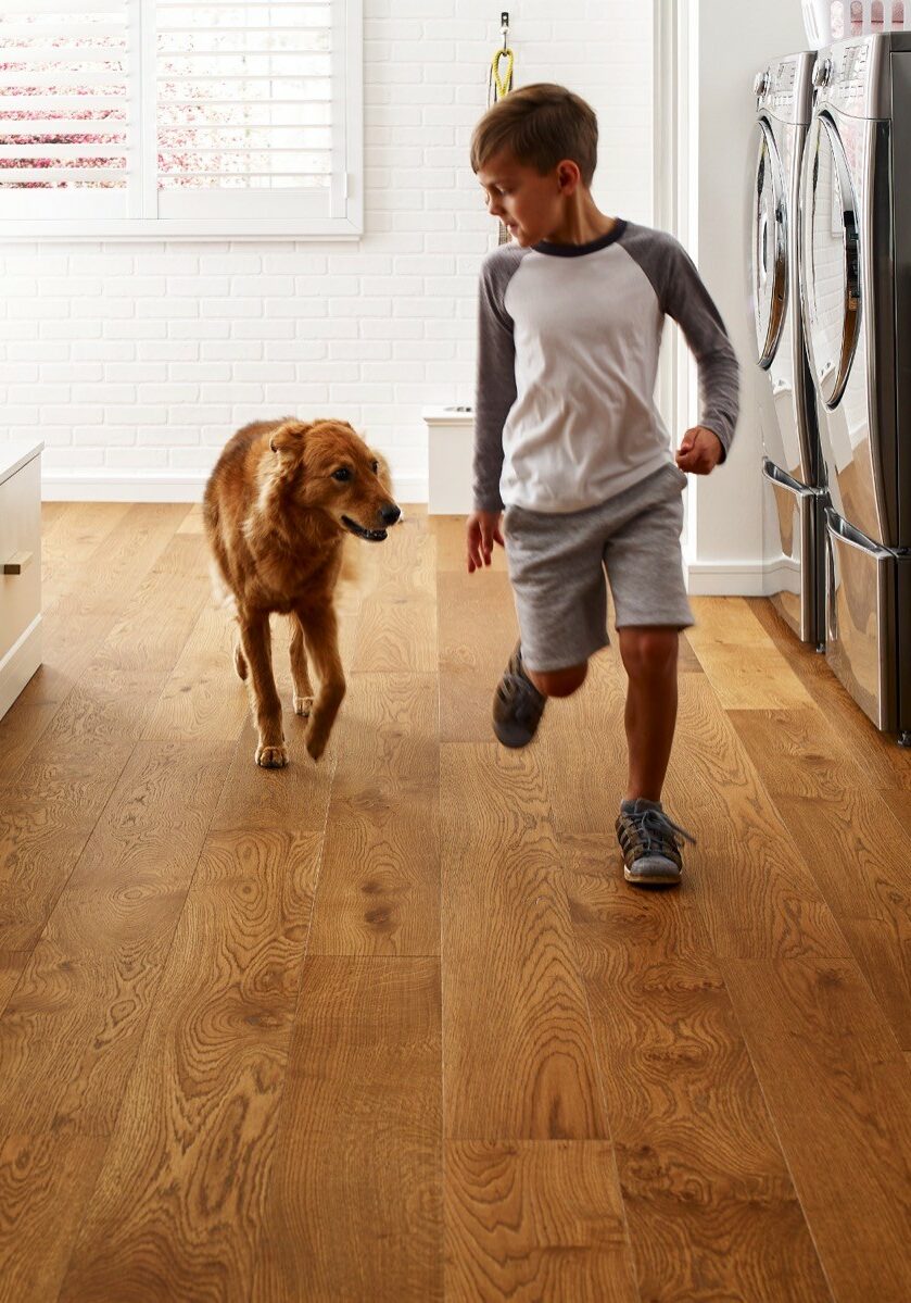 Kid running with dog | TLC Floor Center